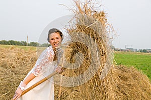 Country bride on haystack