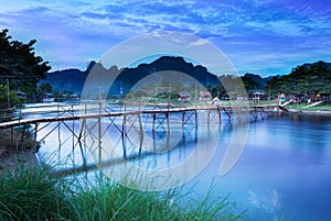 Country bridge across Nam Song river, Vang Vieng, Laos.