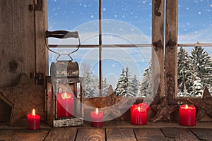 Country Christmas decoration: wooden window decorated with red c