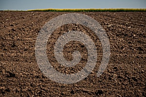 Unworked land, field. Dirt texture. Country dirt field texture. photo