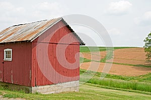 Country farm building and field