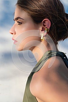 Country girl close up. Country style woman, close up face in nature at the village outdoors. Beautiful sensual girl on