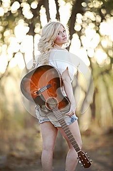 Country Girl and Guitar photo