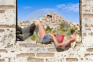 Country girl resting on window sill