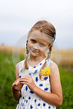 Country girl with yellow flower