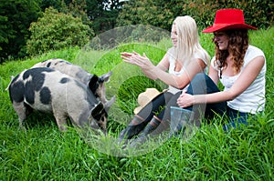 Country Girls with pigs