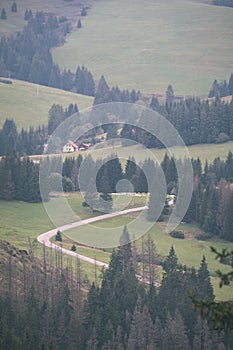 country gravel road leading up to the mountains - vintage retro