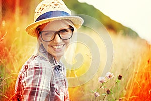 Country hipster. Lomography portrait of a young hipster woman in a field.