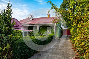 A country house with a garden on an autumn day