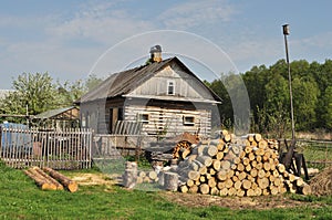 Country house with pile of firewood