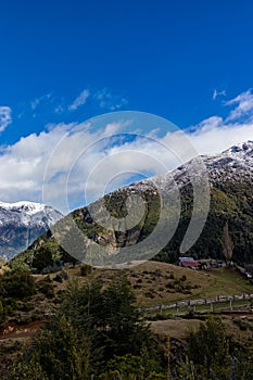 A country house surrounded by mountains