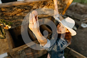 Country joy, woman with an egg in a country chicken coop.