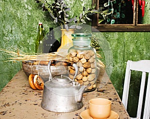 Country kitchen with green walls and wood table, rural look