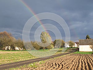 Country landscape with double rainbow