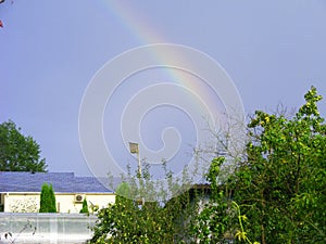 Country landscape : nestling box in the sky with rainbow