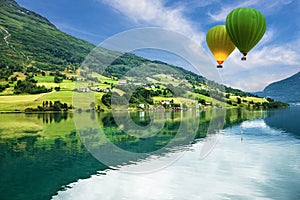 Country landscape, Olden, Norway. Hot air balloons