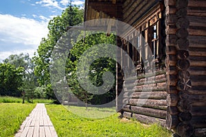 Country log house with window platband in russian style
