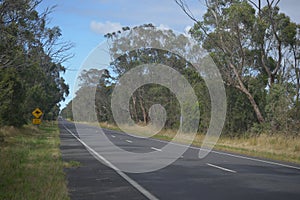 Country main road in rural Victoria with sign.