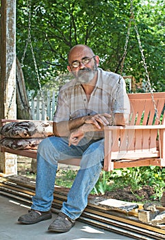 Country Man on Porch Swing