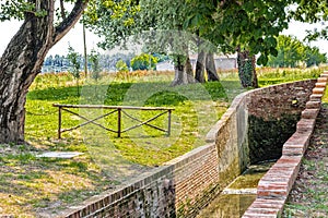 Country mill along dry river