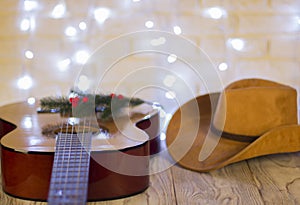 Country music christmas with guitar and cowboy hat