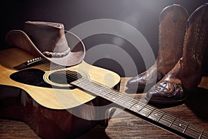 Country music festival live concert with acoustic guitar, cowboy hat and boots