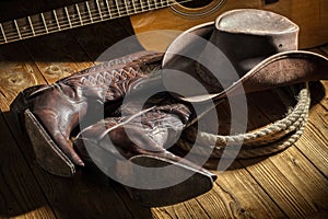 Country music festival live concert with acoustic guitar, cowboy hat and boots