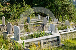 Country Muslim cemetery with green plants in Turkey