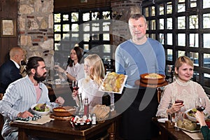 Country restaurant owner with traditional meals