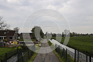 Country road called Tweede Tochtweg in zuidplaspolder in Nieuwerkerk aan de IJssel