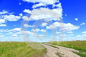 Country road and clouds in summer