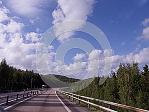 Country Road, cloudy sommar fourney in Sweden photo
