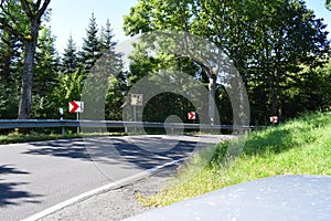 country road curve with a traffic mirror