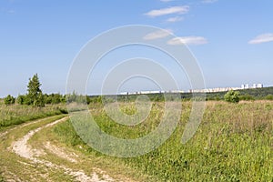 Country road in the field, landscape. Away new city district Domodedovo, Russia