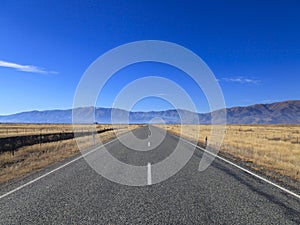 Country road leading to Mountains