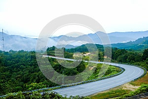 Country road at mountain area with low cloud after rain in Gua Musang, Kelantan, Malaysia