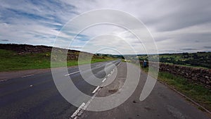 Country road running through dramatic North Pennines Area of Outstanding Beauty