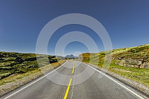 Country road through Scandinavian landscape
