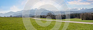 Country road to Wilparting tourist destination, Irschenberg, with stunning alps view photo