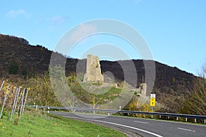 country road view ruin of Burg Coraidelstein and a traffic sign for the blocked main road