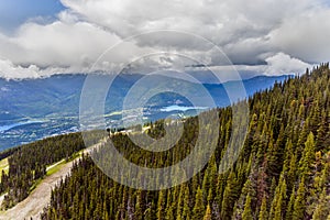 Country road and village in the mountains between two lakes