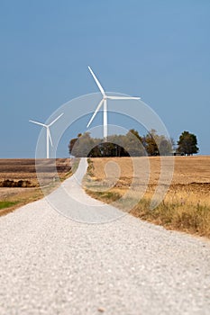 Country road and a wind farm