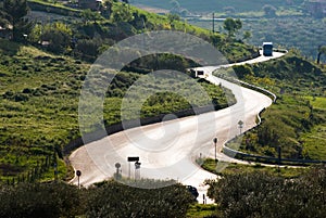 Country road winding in backlight