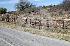 Country road with wooden fence