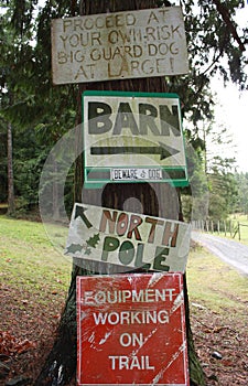 Country Signs Posted on a Tree