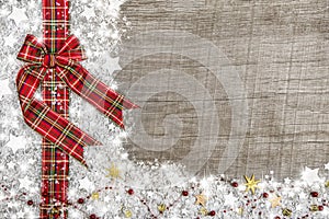 Country style christmas background with red green checked ribbon