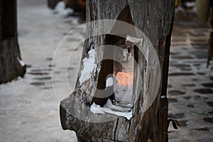 Country style outdoor lighting in a wooden log