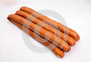 Country style smoked sausage in long rings, isolated. Traditional meat product, packshot photo for package design.