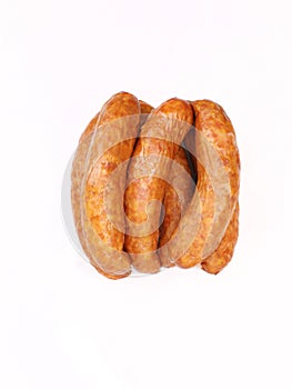 Country style smoked sausage in rings, isolated. Traditional meat product, packshot photo for package design.
