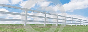 Country style wooden fence against cloud blue sky